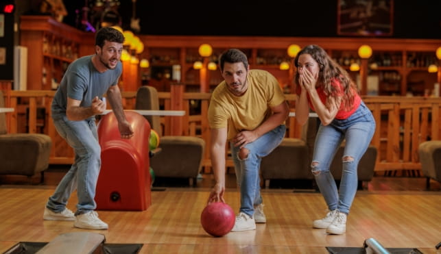 Group of friends bowling